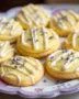 Beautifully decorated Lemon Lavender Cookies Sablés with icing and lavender garnish, perfect for serving.