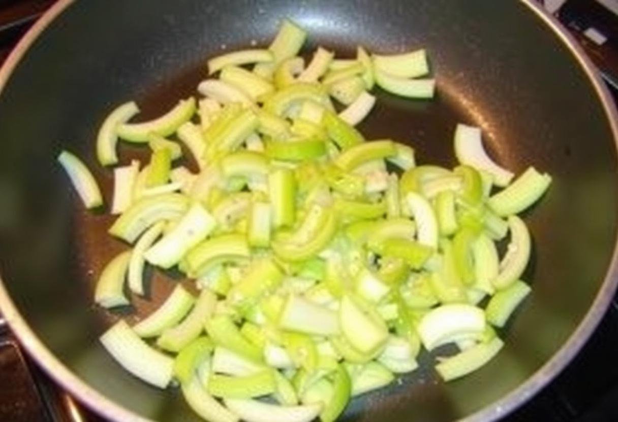 Cuisson des poireaux pour la tarte au poireau, donnant une texture fondante.