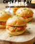 Three mini buffalo chicken sliders on a soft pretzel-style slider bun, glazed with glossy red buffalo sauce, topped with crumbled blue cheese and chopped celery, served on a rustic wood board with a side of ranch dip in a tiny white bowl.